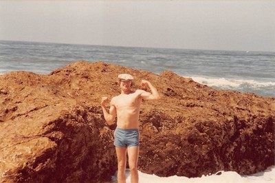 Vintage Young Man Flexing Beach 1970s Photo Swimsuit Trunks Bulge Cap Glasses