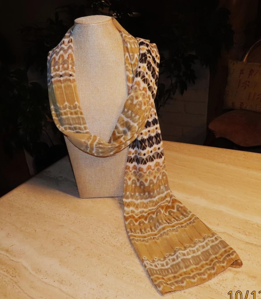 Echo oblong scarf; abstract; tan white black; metallic accents; poly; 72x20 in.