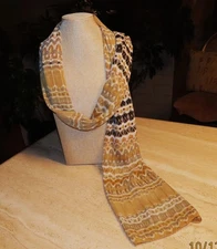 Echo oblong scarf; abstract; tan white black; metallic accents; poly; 72x20 in.