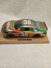 1 of 166  Bank  36 PONTIAC SKITTLES STARBURST NASCAR 1:24 GOLD Derrick Cope