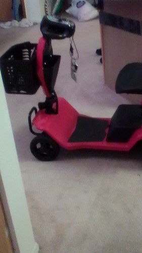 Red 4-Wheeled Mobility Scooter with Basket and Black Seat