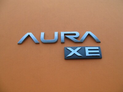 07 08 09 SATURN AURA XE REAR TRUNK LID GATE EMBLEM LOGO BADGE SIGN SYMBOL A2449