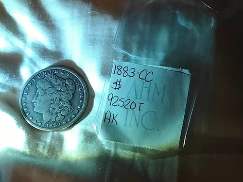 1883 Carson City "CC" Silver Morgan Dollar. EF or VF condition.