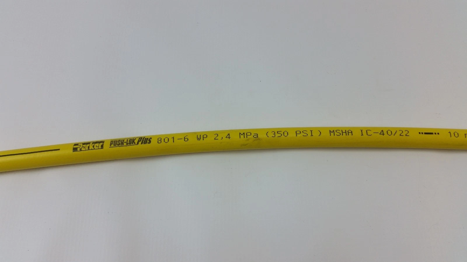 Parker Push-Lok Plus 801-6 WP 2.4 MPa (350 PSI) print on the yellow hose cover