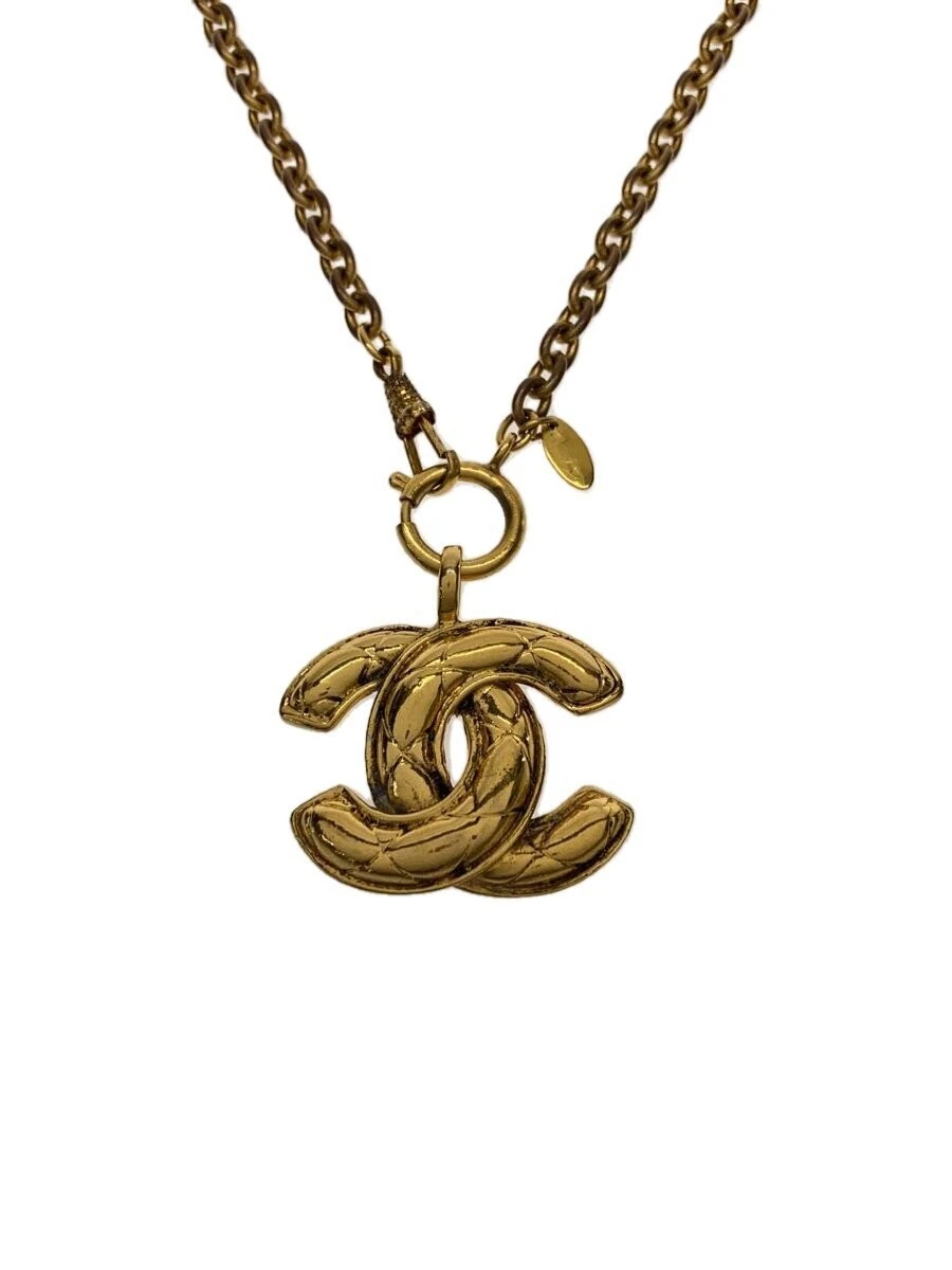 Collana CHANEL marca Coco oro con top donna usata