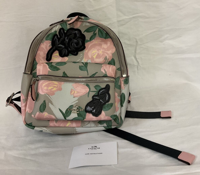 coach camo rose backpack Signature Taylor Tote 35L Traditional Backpack 17in (43cm) x 12in (30cm) Compartment Area Realtree Jumbo Logo Patch Included Realtree Antler Top Patch Included Mini Realtree Shoulder Strap Patch Included Dual Cup Holders (Shakers NOT Included) Protective Inside Computer Pouch 10in x 10in Fits Carry On Regulations Overhead Compartment YKK Japanese Upgraded Two Way Water Resistant Zippers 180 Degree Opening for easy packing Waterproof Surface Oxford 1000D Polyester Load Test up to 35lbs Coach Camo Rose Signature Crossbody