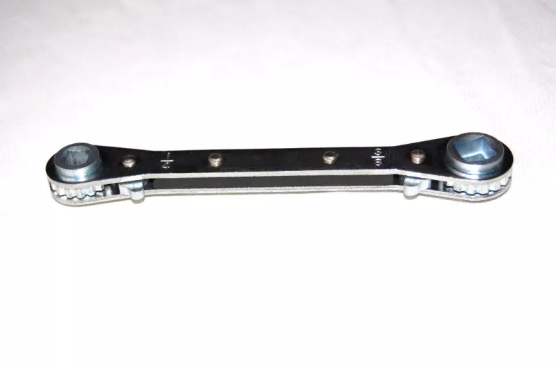Service valve wrench outlet