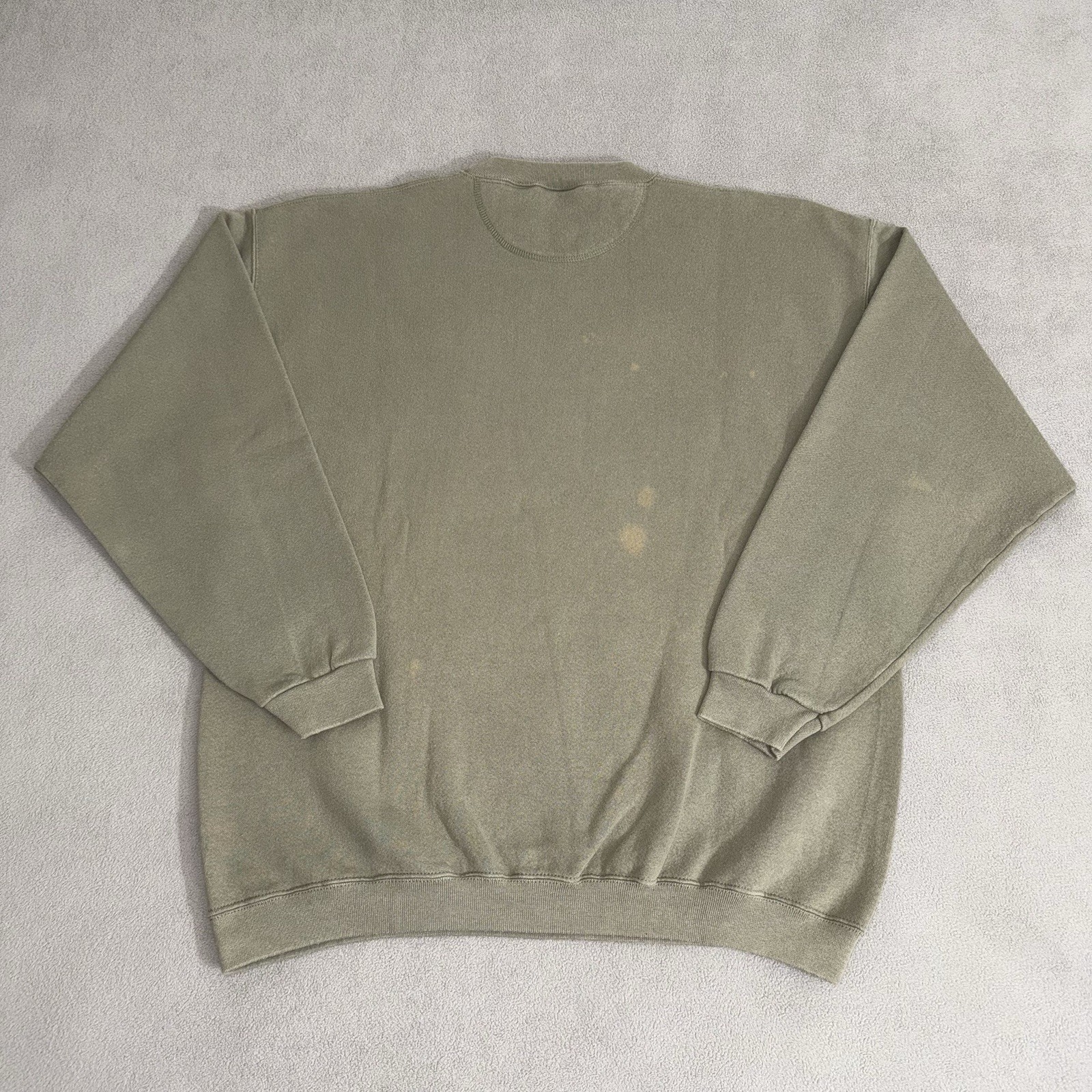 Olive green vintage Eddie Bauer sweatshirt size L with white text, brown hip hop stain, and ribbed cuffs.