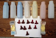 Vintage Evenflo Plastic 8 Oz baby bottles , nipples and caps.