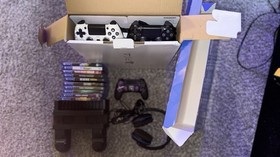 Play Station Slim 1- TB, 3 Controllers, 10 Games, 1 USB mic.  1 Fan/Charge Stand