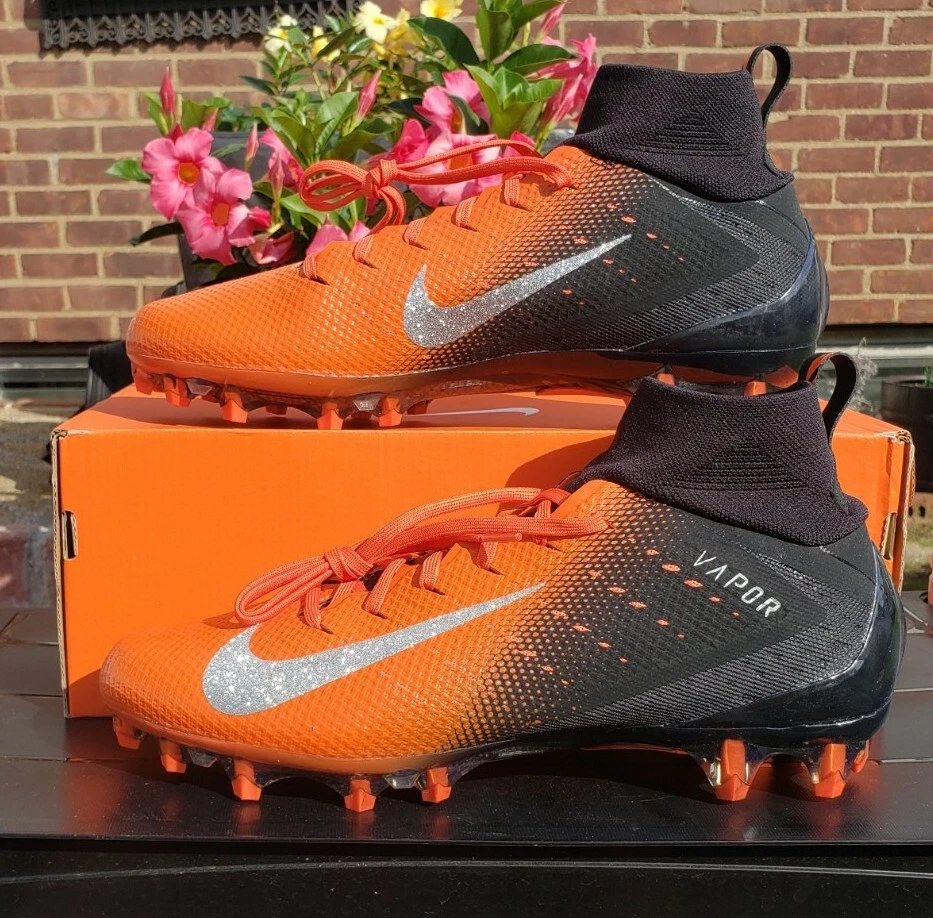 Orange and top black football cleats