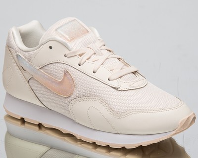 nike outburst trainers in white and pink