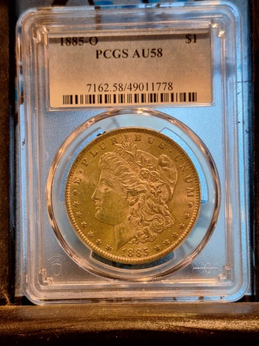 1885 O MORGAN SILVER DOLLAR, Graded AU-58 By PCGS Vam 2