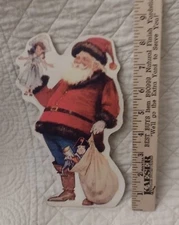 Dummy Board Old Fashioned Vintage St Nick Santa in blue jeans with Sack of Toys