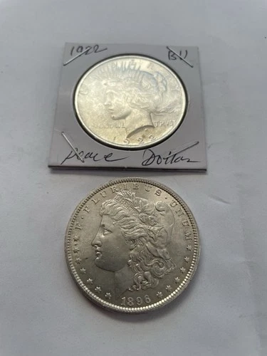 1922 Silver Peace Dollar And 1896 Silver Morgan Brilliant Uncirculated.
