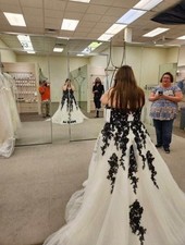 wedding dress size 18, hasn’t been out the bag since buying. Black and ivory