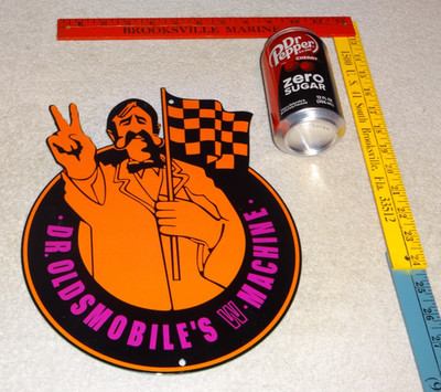 VINTAGE DR. OLDSMOBILE MUSCLE CAR MACHINE MAN 12'' ENAMEL METAL GASOLINE OIL SIGN