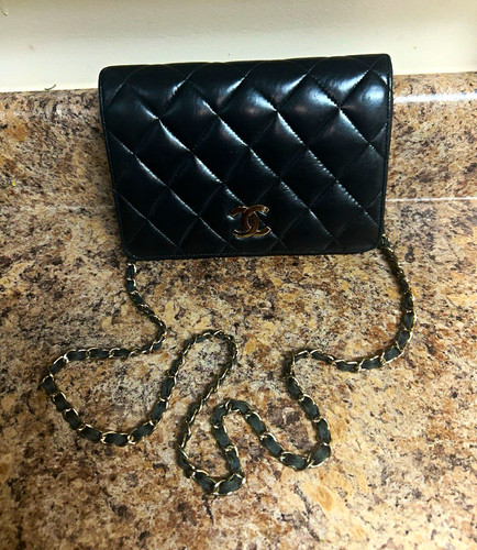 Chanel Classic Wallet on Chain (WOC) in black quilted lambskin leather with gold