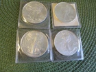 4 US SILVER EAGLES ONE OUNCE SILVER DOLLARS UNC,