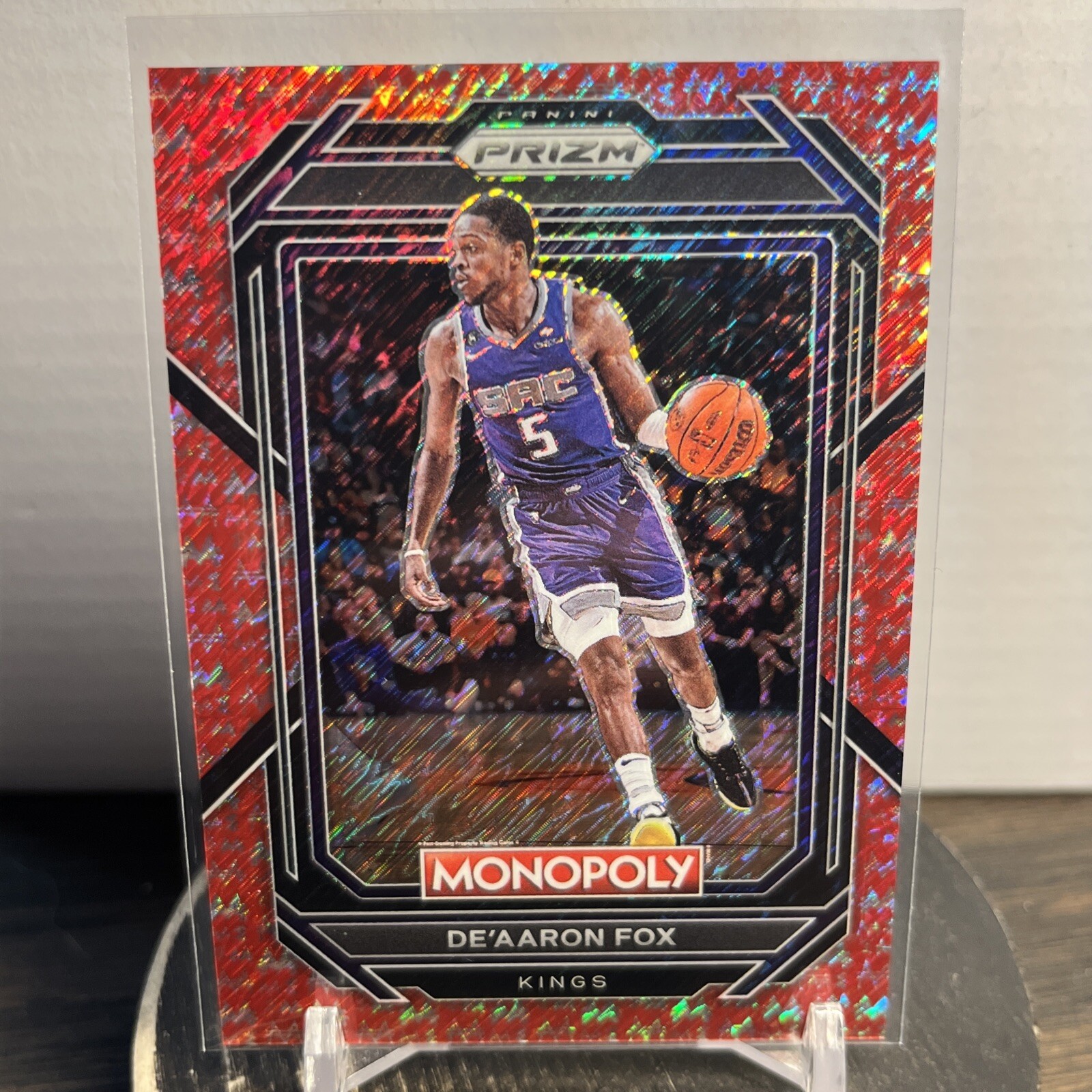 De’Aaron Fox 2022 Panini Prizm Monopoly Red Money Shimmer 009/100 #76