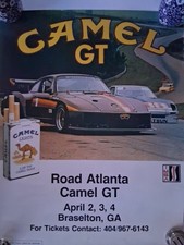 vintage poster featuring a Porsche 935/78 racing car from the IMSA Camel GT...