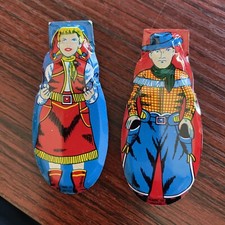 Vintage toy clickers, cowboy  girl c 1950/60, made in japan