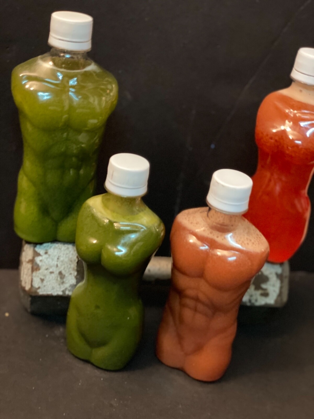 Wholesale lot of muscle shaped fitness water bottles