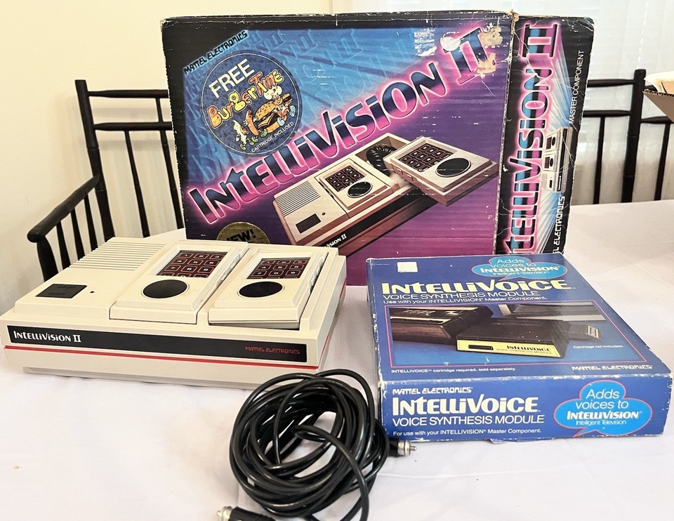The Intellivision II with its creepy Voice Synthesis Module is a uniquely weird and playable artifact — 7 games and the voice add-on make this a complete, characterful setup.