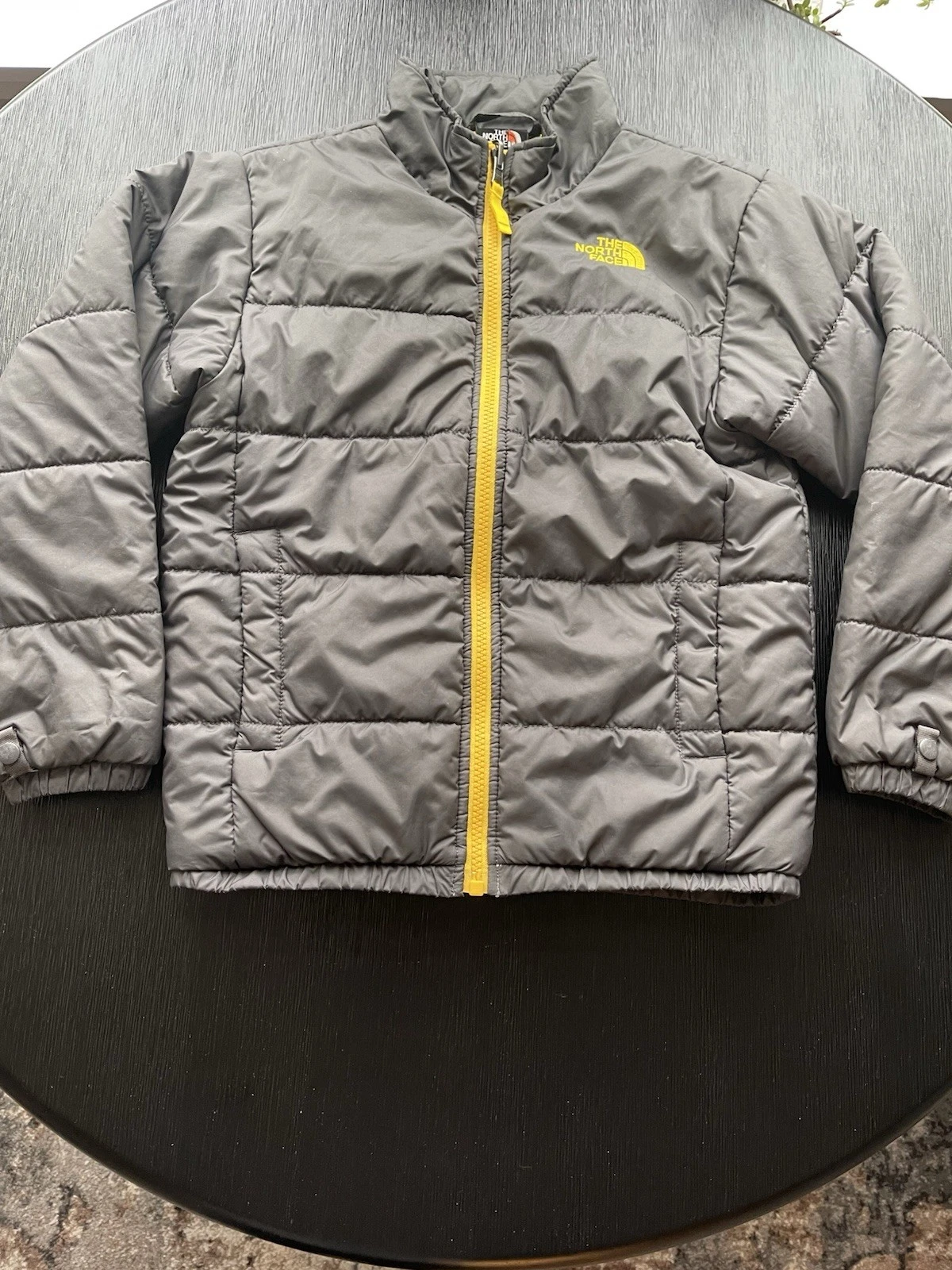 North Face Boys Puffy Jacket Size Small Gray With Yellow Zipper, Lining And Logo