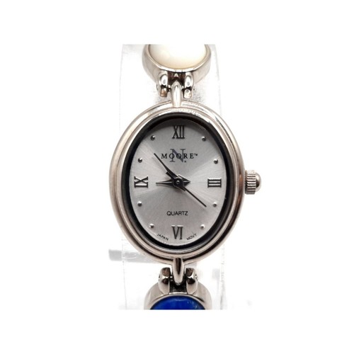 Montre femme N Moore pile neuve ton argent 18 mm