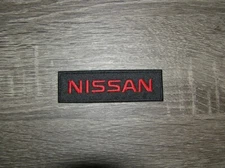 Nissan Motorsports Racing Car Red & Black Embroidered Iron On Patch 4" x 1.25"
