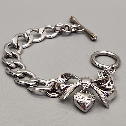 Pulsera de cadena Juicy Couture arco corazón cinta colgante tono plata bordillo 7" - Imagen 2 de 11