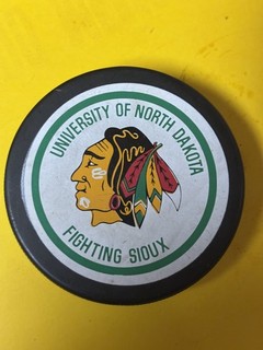 OLD VINTAGE HOCKEY PUCK UNIVERSITY OF NORTH DAKOTA FIGHTING SIOUX