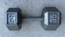 ONE (1) 35 POUND CAST IRON DUMBELL AS PICTURED