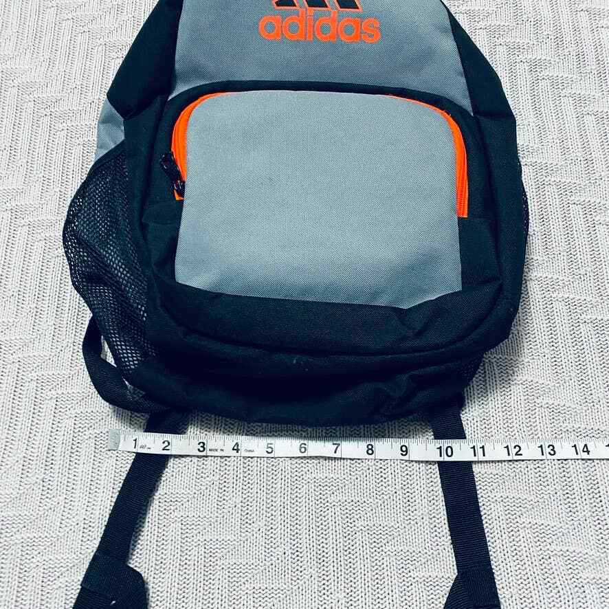 Adidas gray and orange small backpack