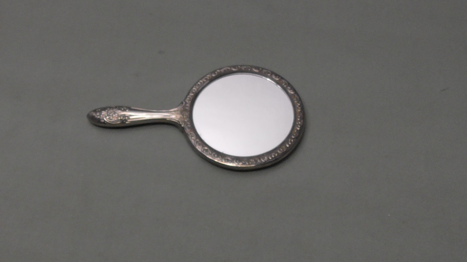 Vintage Hand Held Mirror Round Vanity Silver Plate Heavy Floral Scroll Ornate 9"