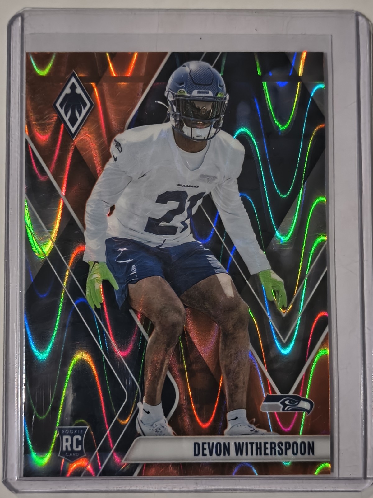 2023 Panini Phoenix - Rookies Devon Witherspoon #145 Orange Seismic /99 (RC)