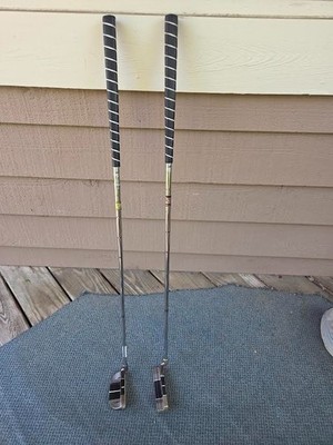 Two used Strata Bank of America putters