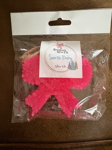 "Santa Baby" scented car air freshener, also known as a "freshie"