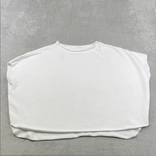 White 100% cotton funnel neck capelet with long sleeves, made in USA, displayed on a textured light gray surface.