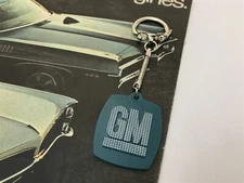 1970's VINTAGE GM KEY CHAIN NEW GM RARE FOR SAFETY'S SAKE FASTEN YOUR SEAT BELT