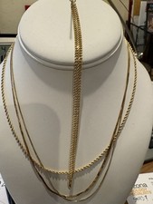3 14K gold chains 6.0 grams, One 12K chain 5.4 grams total weight 11.4 grams NR