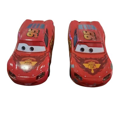 Disney Pixar CARS Toy diecast Retired Lightning McQueen Rusteze Logo x2 cars.