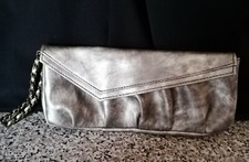 Ladies metallic looking party bag with ornate twisted chain strap