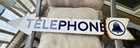 VINTAGE DOUBLE-SIDED PORCELAIN TELEPHONE ARROW SIGN - 35 1/2 INCHES LONG
