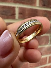 18ct 0.60ct diamond full eternity ring, size N1/2, 4.00grams