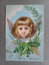 DULCE TARJETA DE NAVIDAD VICTORIANA CABEZA DE ÁNGEL ALADO Y FOLLAJE