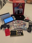 Perfect condition Nintendo Switch Oled Model 64GB - barely used. games and more!
