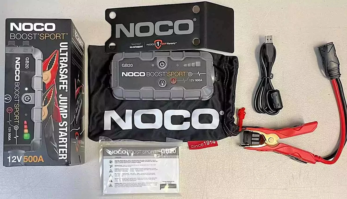 A NOCO 500A jump starter kit, displayed on a work surface.