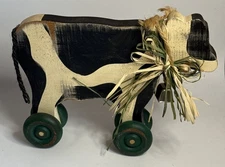 Primitive Folk Art Cow On Wheels Figurine Holstein 7.25” x 9” x 2”